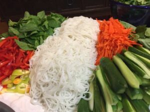 veggies and rice noodles on a plate close-up