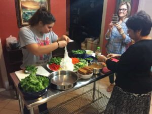 cooking class participants making vietnamese springrolls