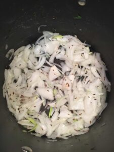vegan saag paneer onions cooking