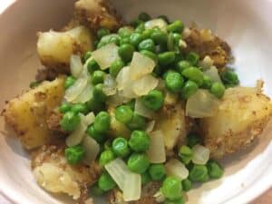 indian spiced potatoes with peas and onions VERY close up