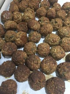 finished eggplant meatballs on a baking tray