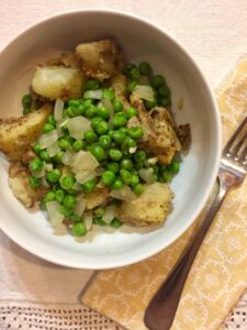 indian spiced potatoes with peas and onions UBER close up