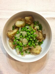 indian spiced potatoes with peas and onions