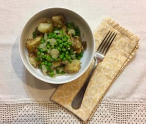 indian spiced potatoes with peas and onions