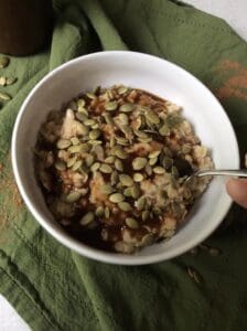 oatmeal with pumpkin seeds on top