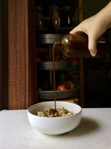 pouring pumpkin spice syrup