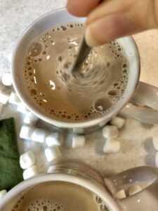 stirring pumpkin spice drinks