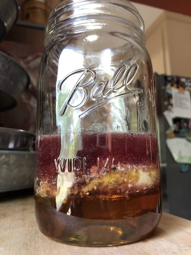 layers of oil-free honey mustard dressing in mason jar