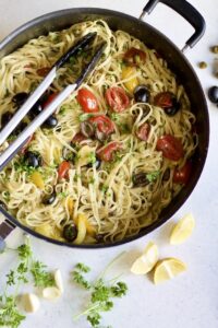 Pot with tongs and garnishes