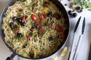 finished meal in pot with tongs
