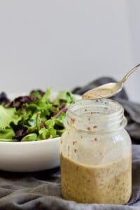 spooning out of mason jar
