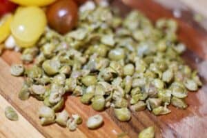 chopped capote capers on cutting board