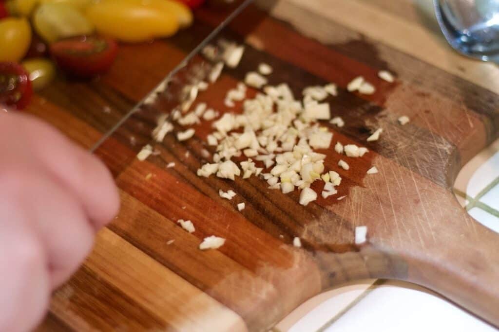minced garlic on cutting board
