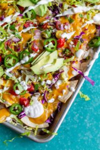chips, sauce, toppings on pan