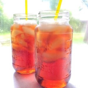 two glasses with straws