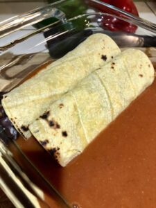 step 5 - add next filled tortilla, slightly overlapping the first