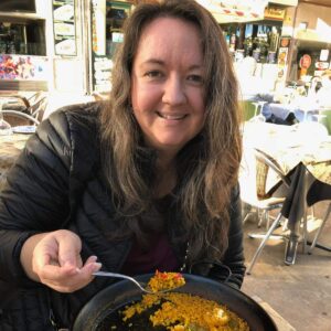 woman eating paella