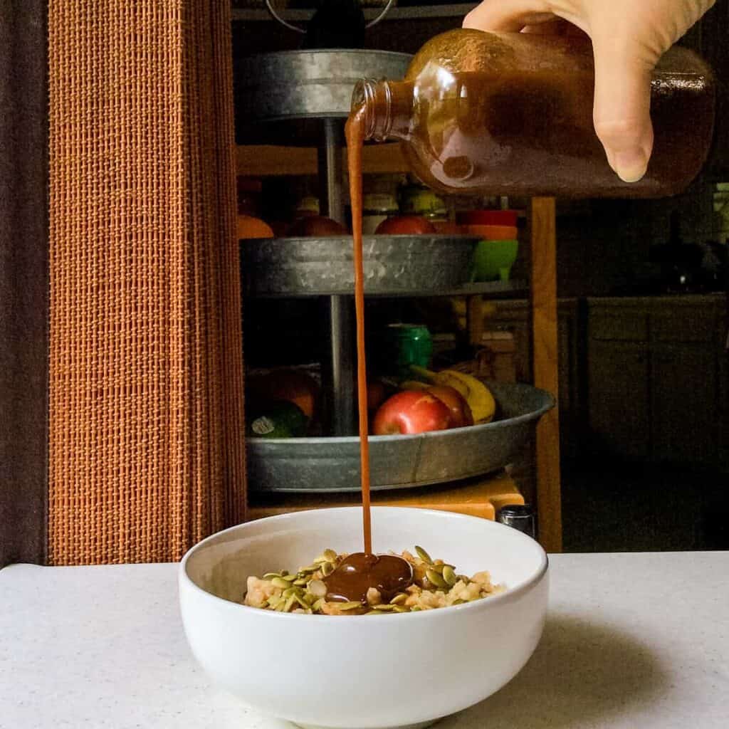 pouring syrup on oatmeal
