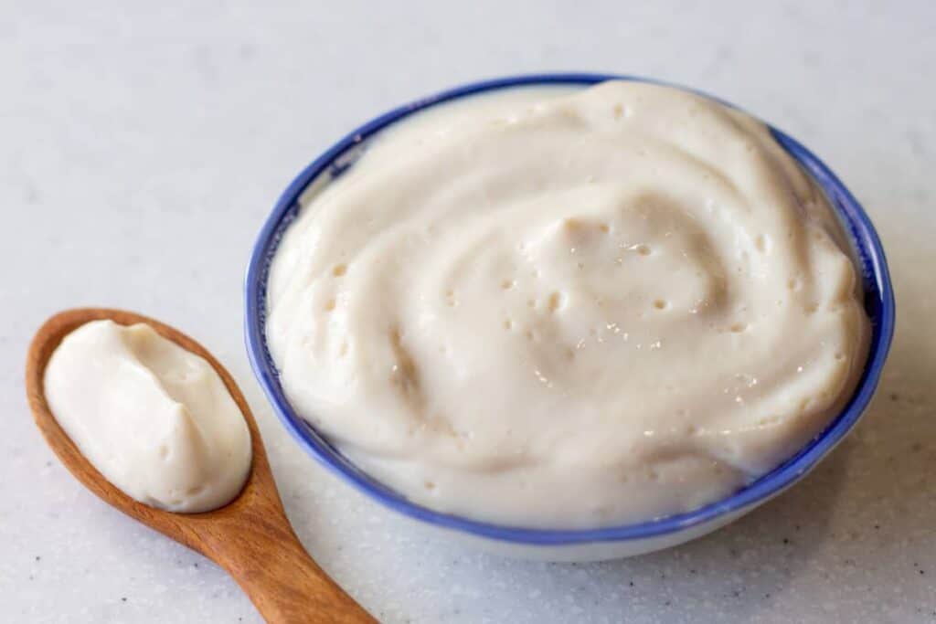 sour cream in bowl and spoon