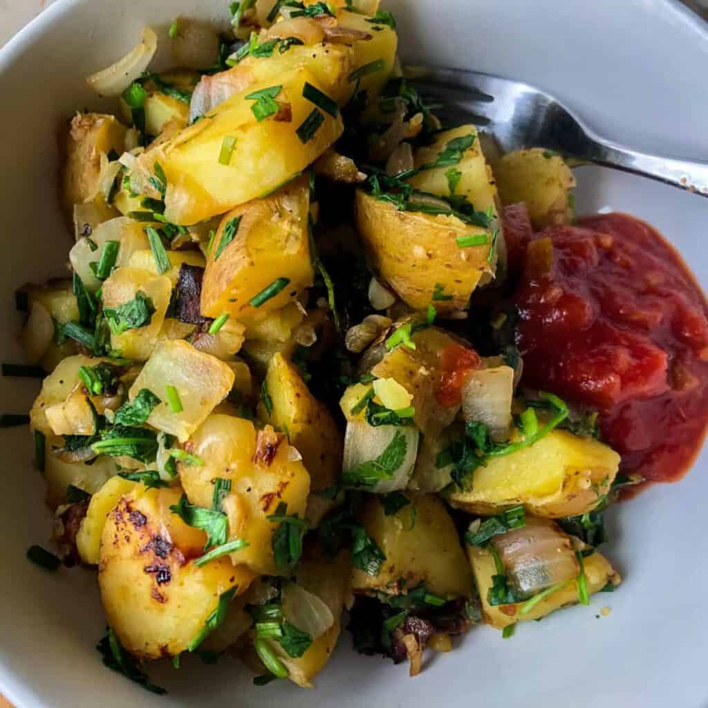 finished potatoes in bowl with salsa