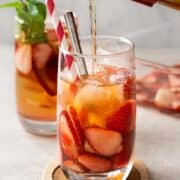 pouring iced tea into glass