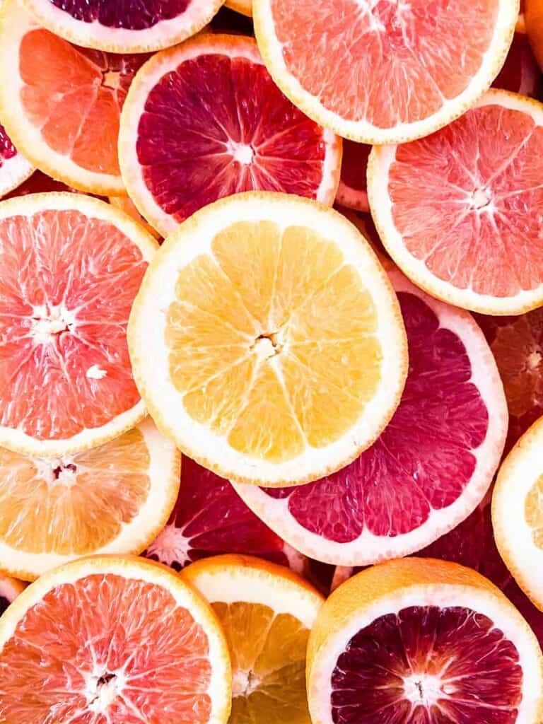 various cut citrus, including cara cara blood oranges and pink grapefruit