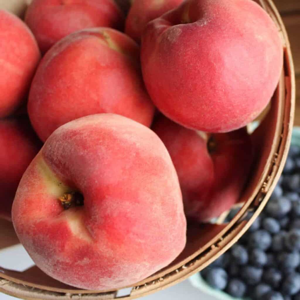 white peaches in a basket