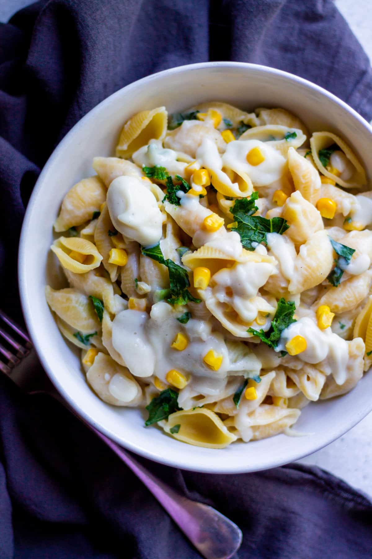 overhead shot of bowl full of pasta with creamy cauliflower bechamel sauce