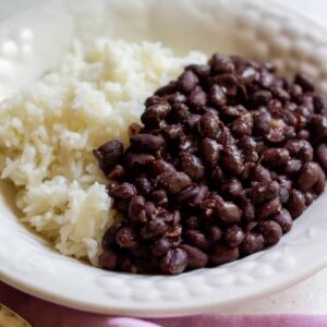 closeup of cooked and seasoned black beans with white rice