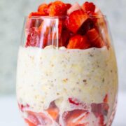 glass with overnight oats and fresh strawberries