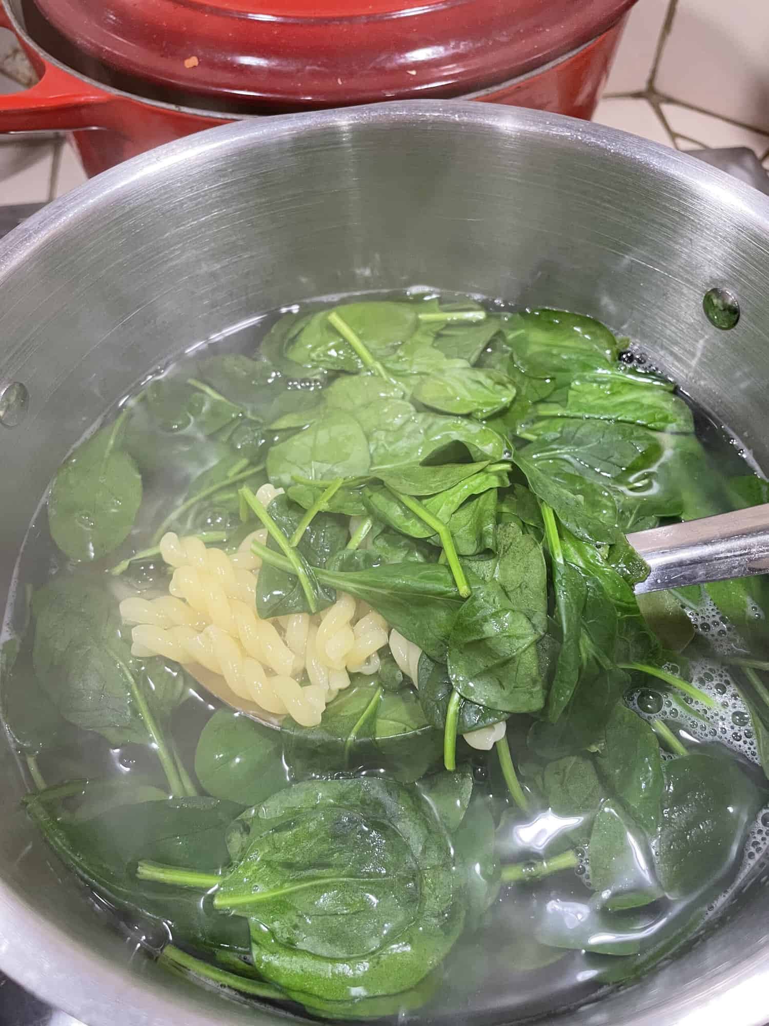 Step 3 add spinach to boiling pasta