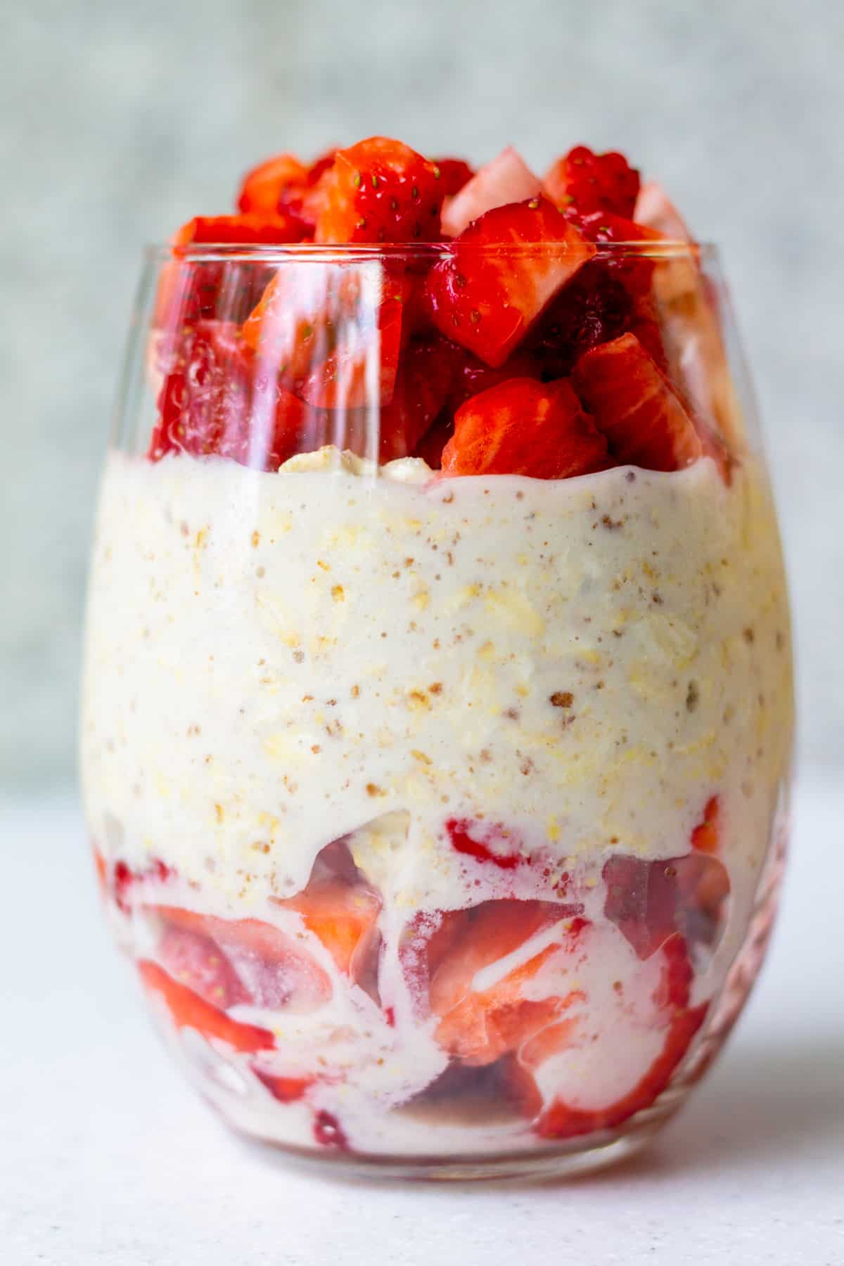 glass with overnight oats and fresh strawberries