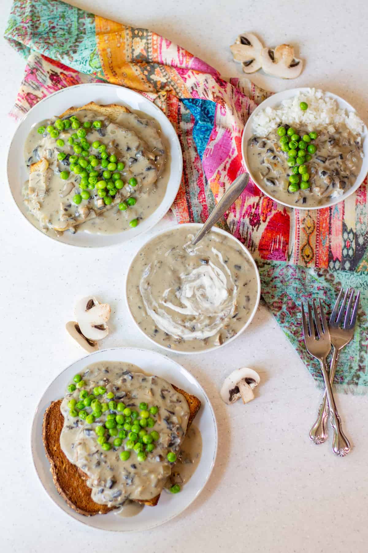 various ways to eat vegan cream of mushroom soup: as a soup, over whole grain toast, over sourdough toast and over rice with green peas