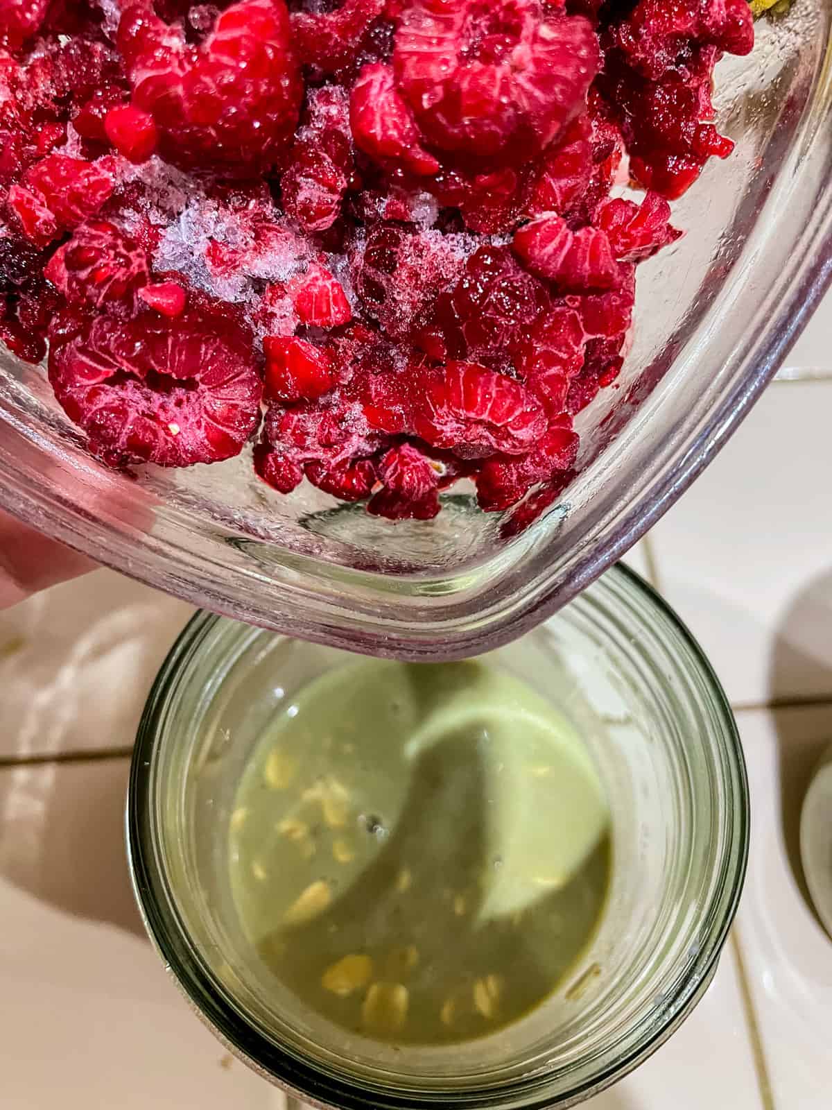 process - adding frozen raspberries to top