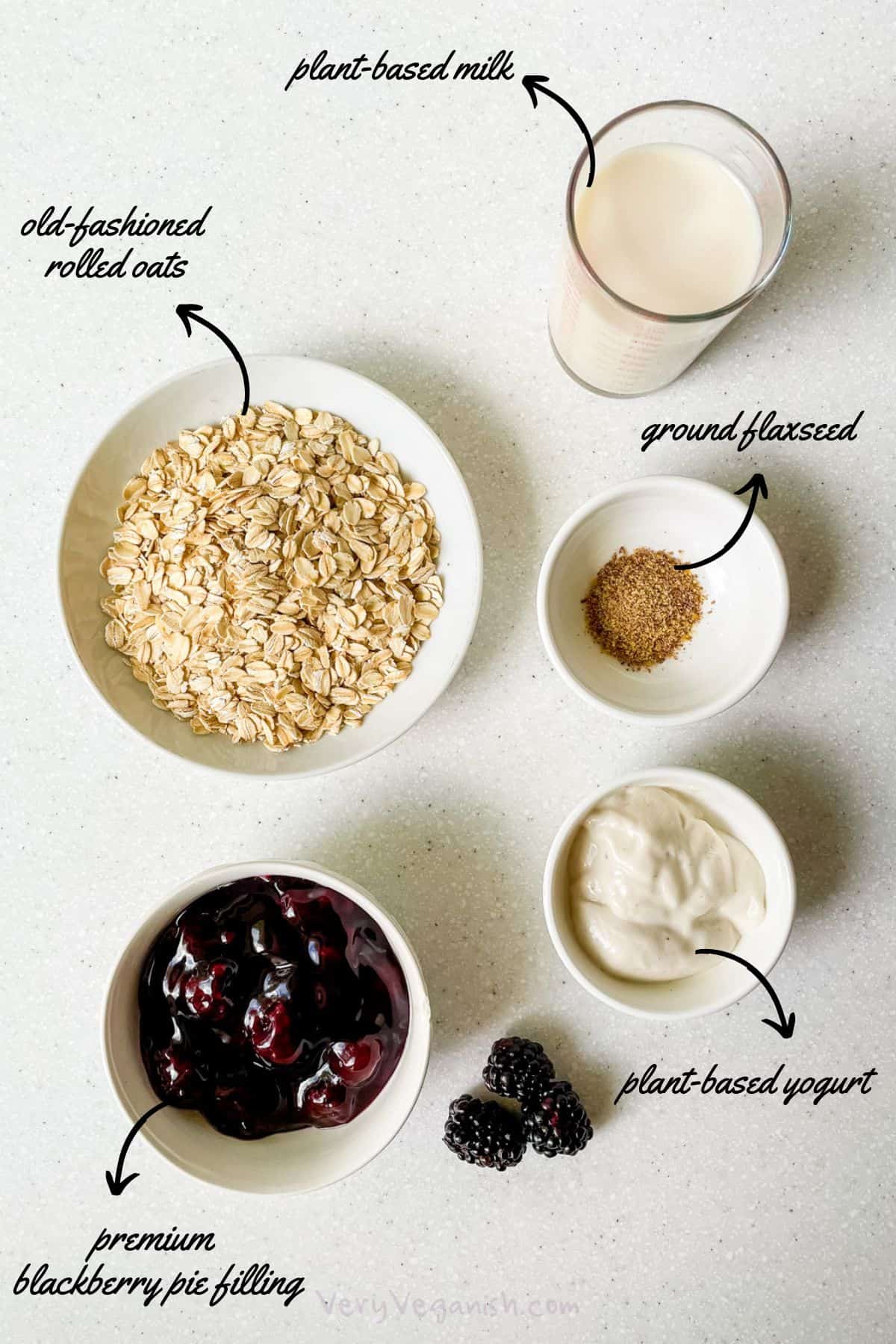 Ingredients for blackberry pie overnight oats: rolled oats, plant-based milk, ground flaxseed, plant-based yogurt, premium blackberry pie filling