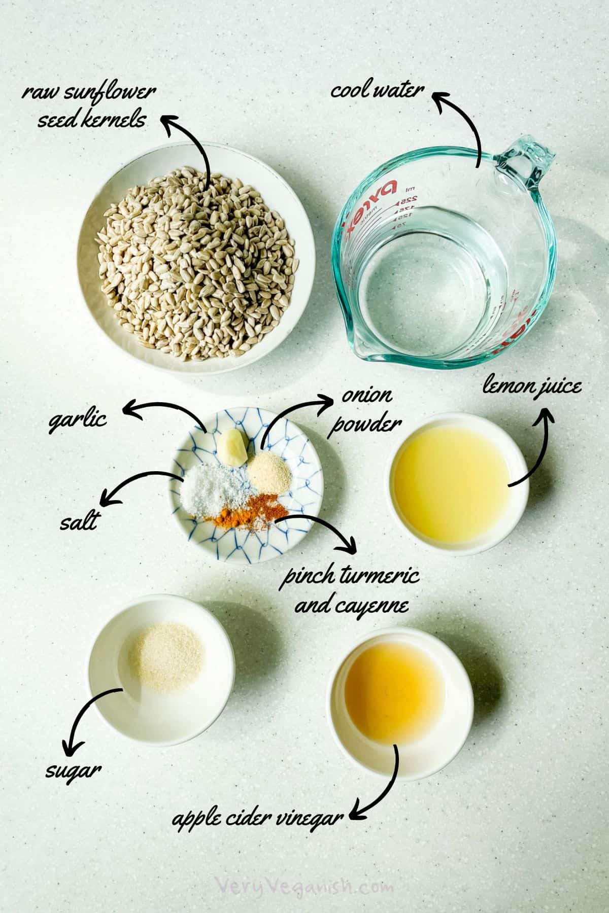 Ingredients for sunflower seed sour cream: raw sunflower seed kernels, cool water, lemon juice, apple cider vinegar, sugar, garlic clove, onion powder, salt, turmeric and cayenne