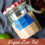 chipotle mayo in jar with red and white lid, next to can of chipotle peppers in adobo sauce, cut limes and title that reads "vegan low fat chipotle mayo" - pinterest image