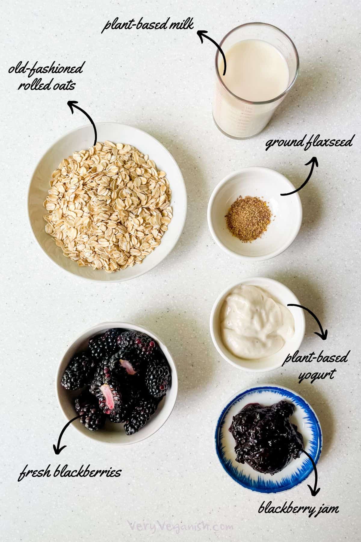 Ingredients for blackberry overnight oats: rolled oats, plant-based milk, ground flaxseed, plant-based yogurt, blackberry jam, fresh or frozen blackberries