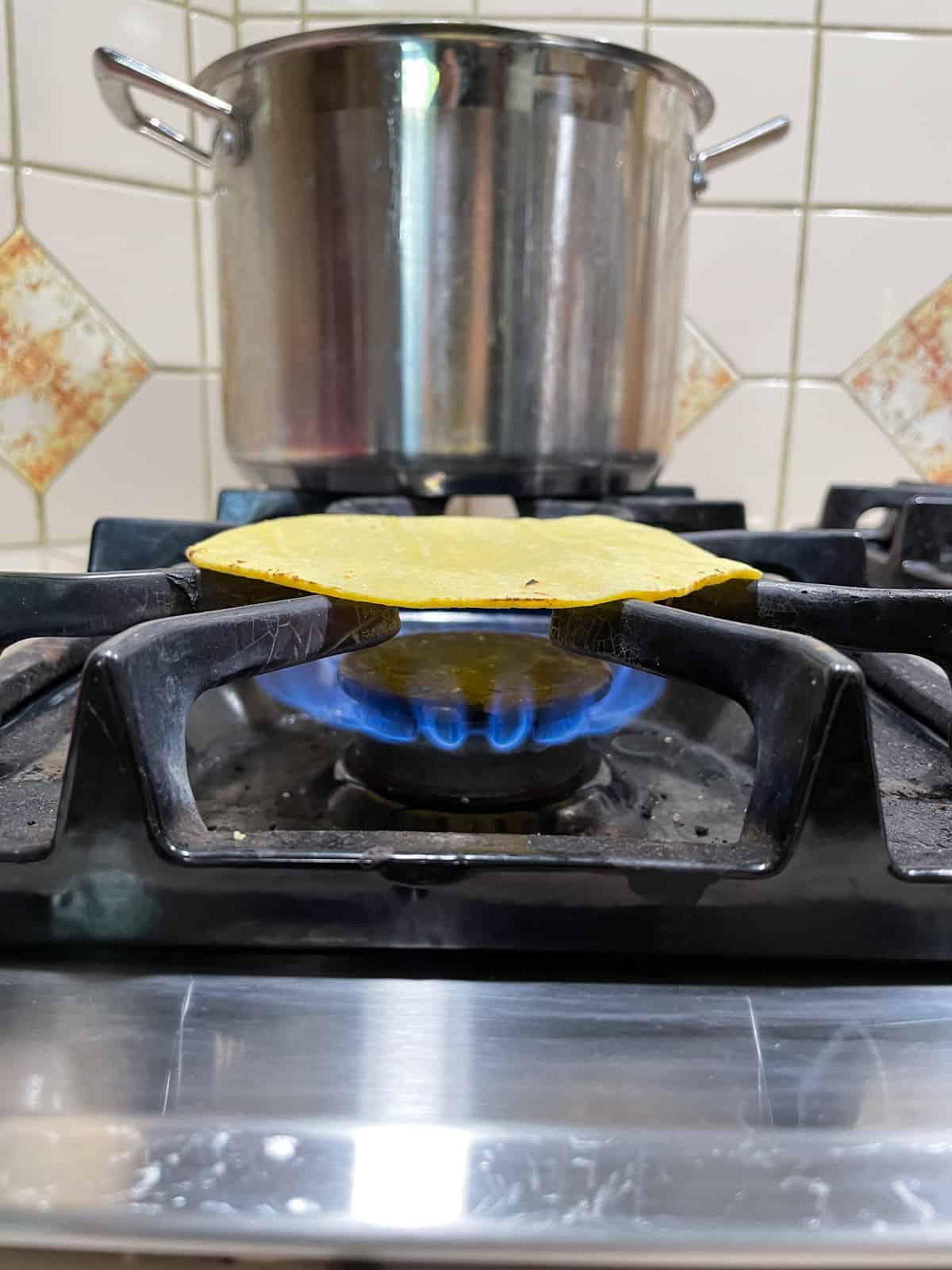 warming corn tortillas on gas stove