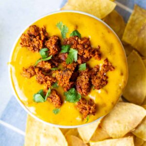 small bowl of vegan choriqueso with cilantro on top