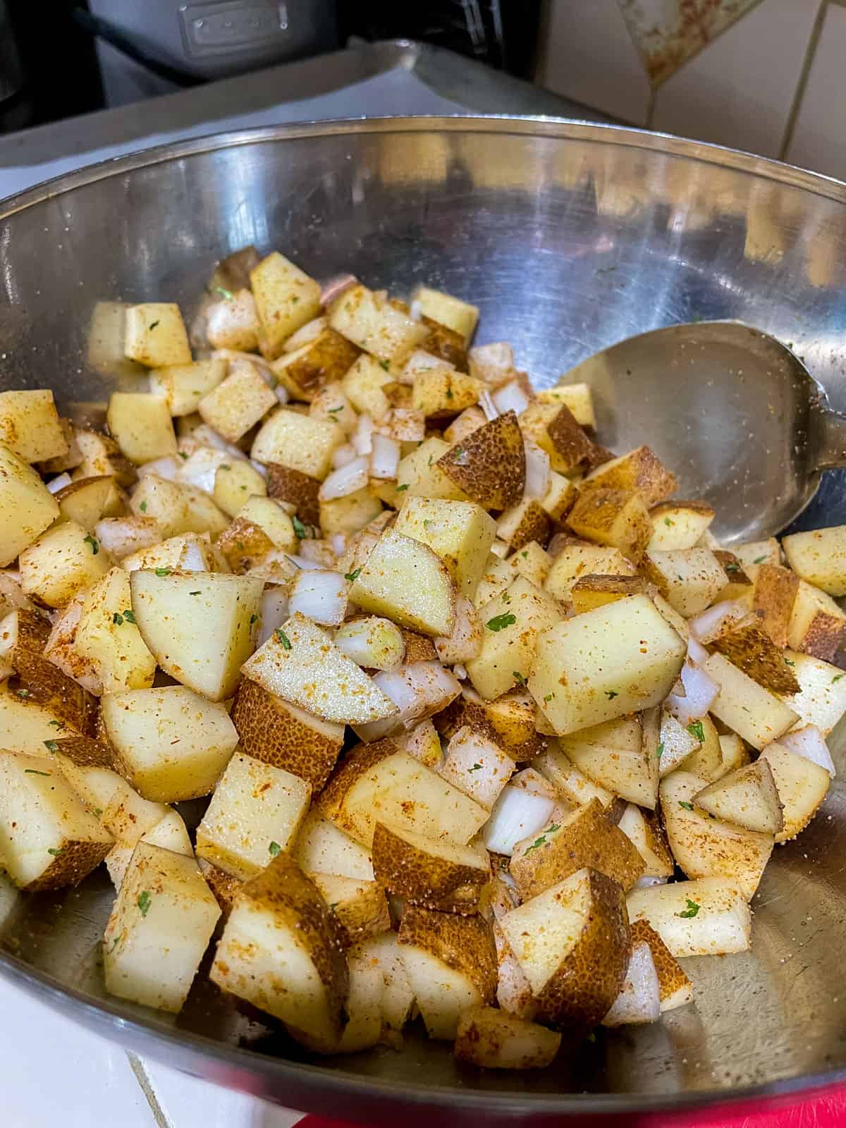 Process step 3 stir spices into potatoes to incorporate