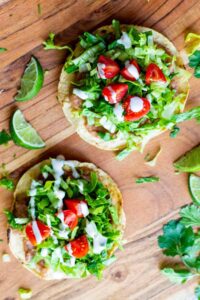 Tostada-de-Frijoles-Vegan-Tostadas-with-Refried-Beans-Lettuce-Tomato-Avocado-and-Crema-4