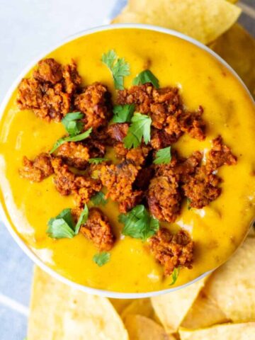 small bowl of vegan choriqueso with cilantro on top