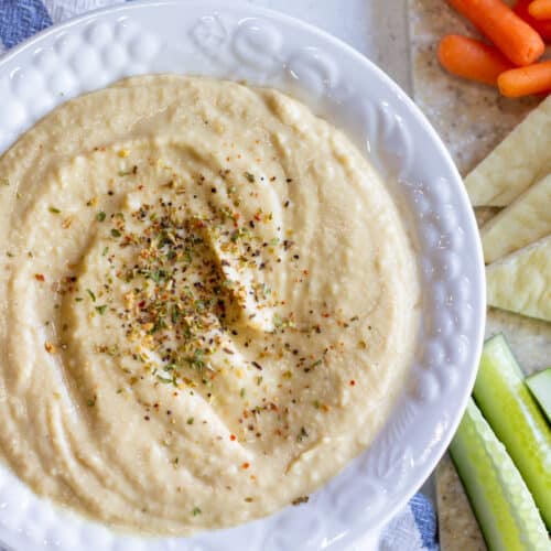 finished hummus in a white bowl