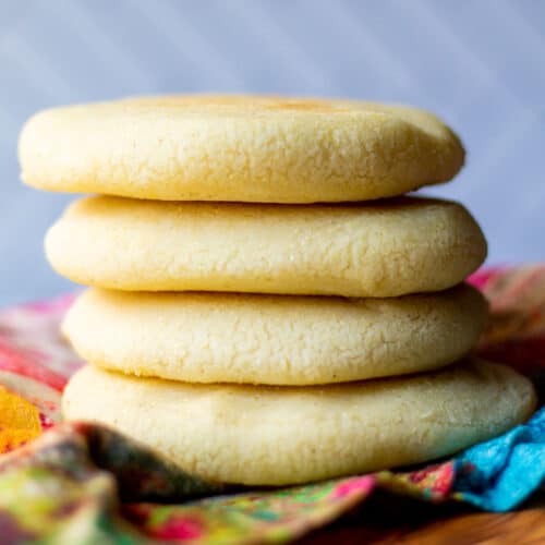 stack of four cooked Venezuelan arepas on a cloth