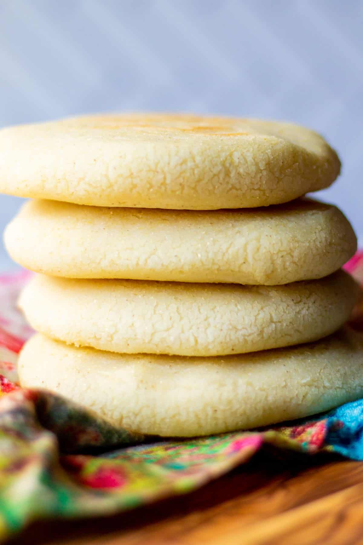 stack of four cooked Venezuelan arepas on a cloth