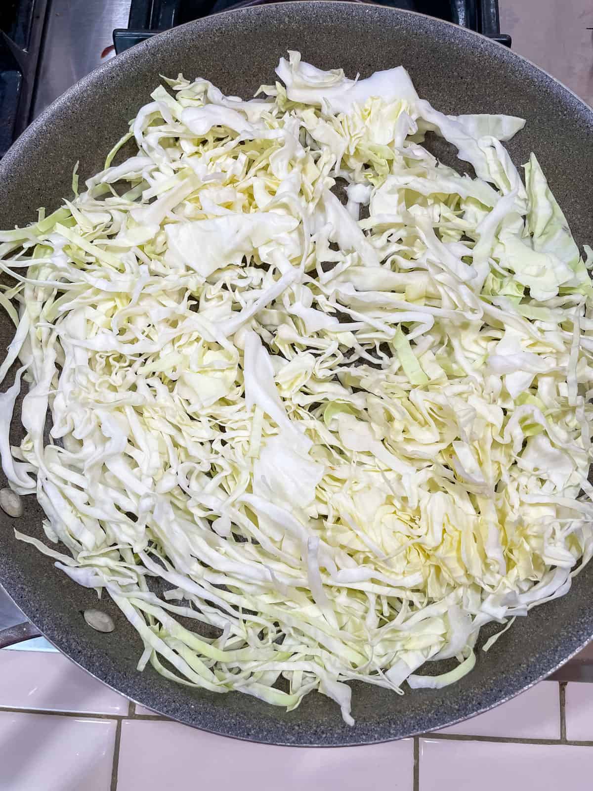 Process Step 1 for Charred Black Pepper Cabbage Strips oil-free - pre-heat skillet over high heat before adding cabbage