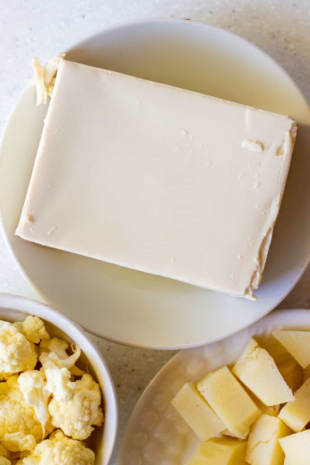 block of silken tofu in white bowl