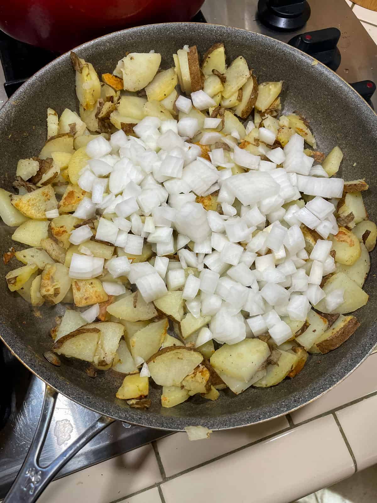 Added onion to browned potatoes in non-stick skillet