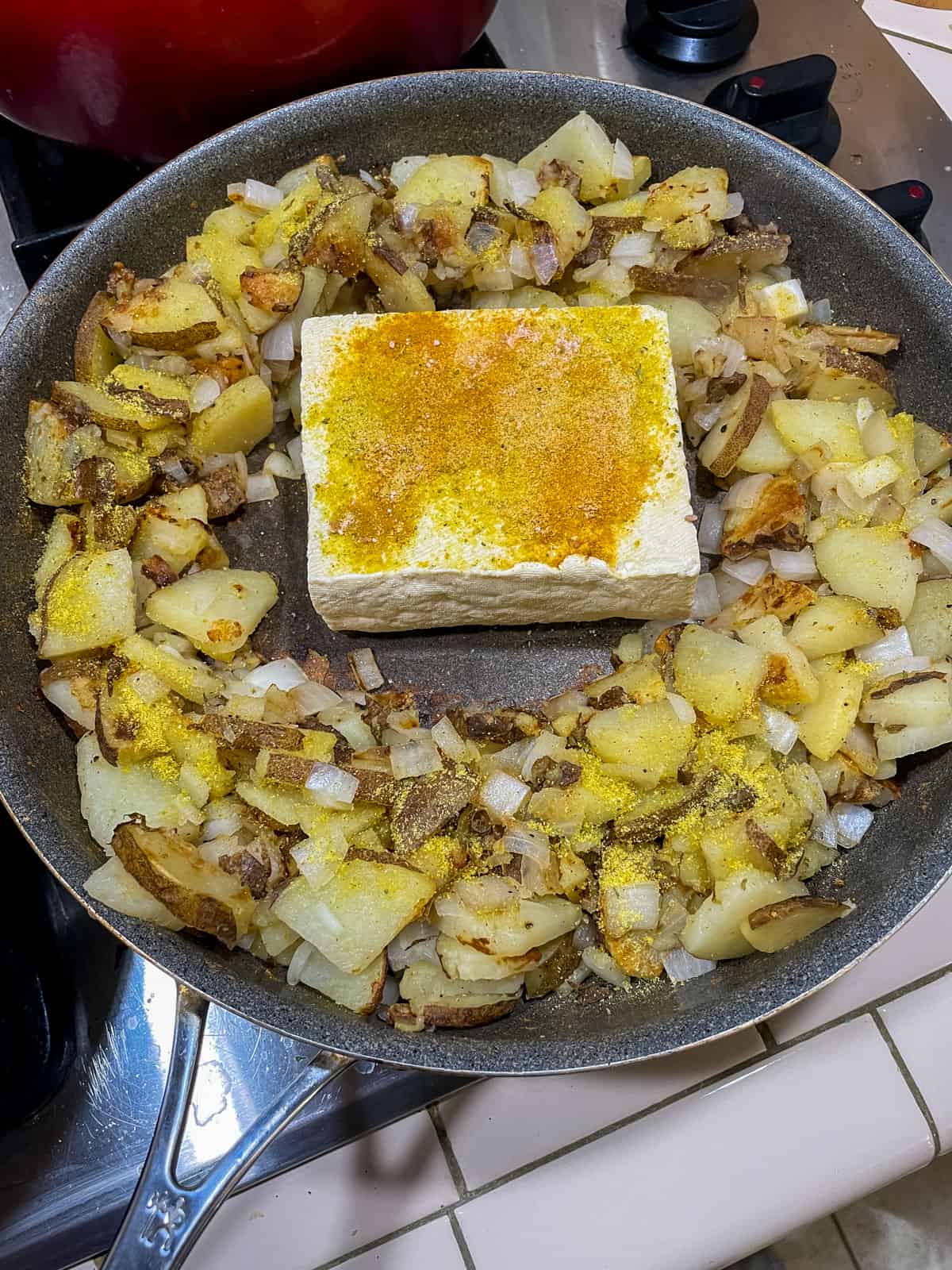 Added spices to tofu and potatoes